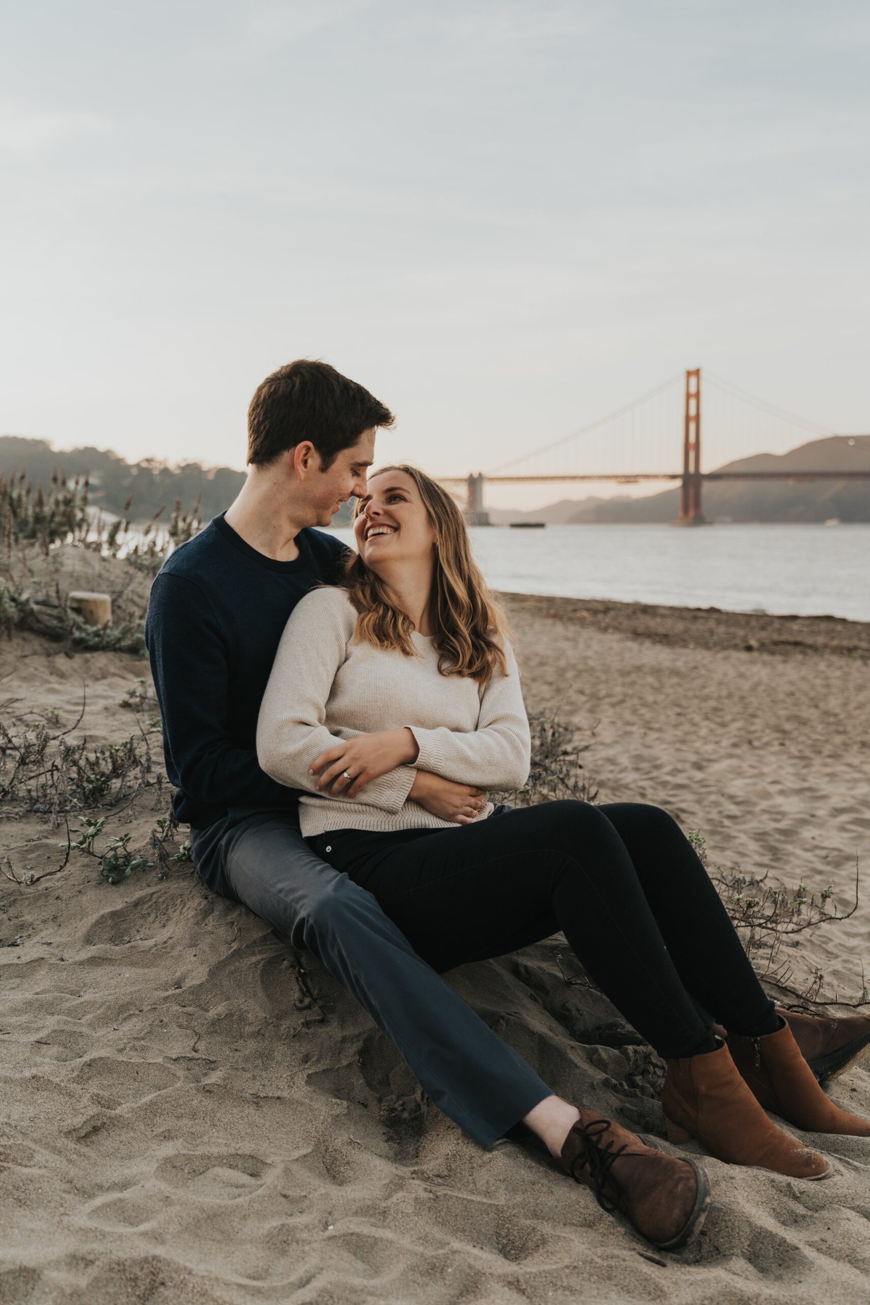 San Francisco Engagement Photos on the beach in front of Golden Gate Bridge