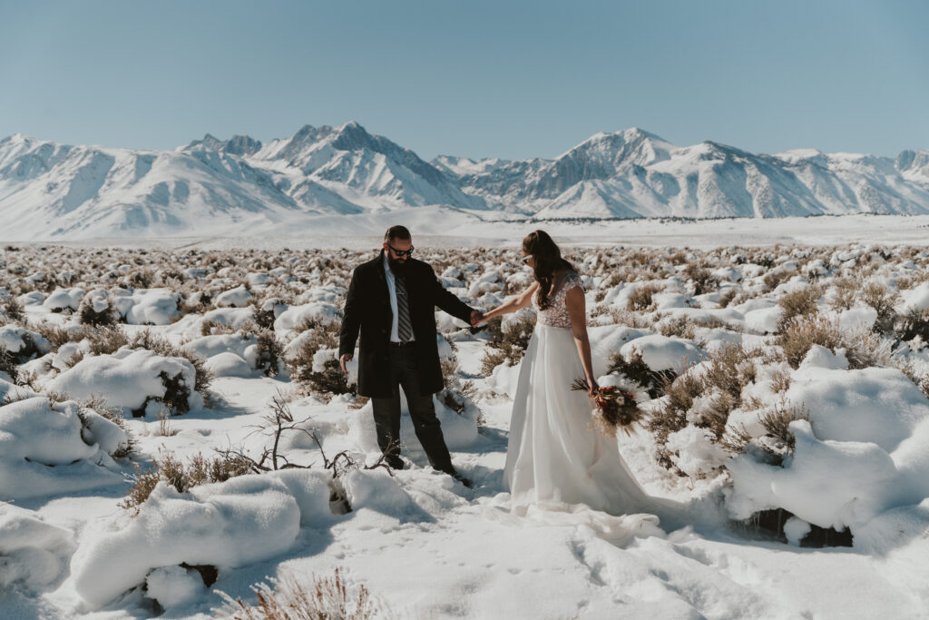Bride and groom see each other for the first time in this snowy winter elopement in Mammoth Lakes