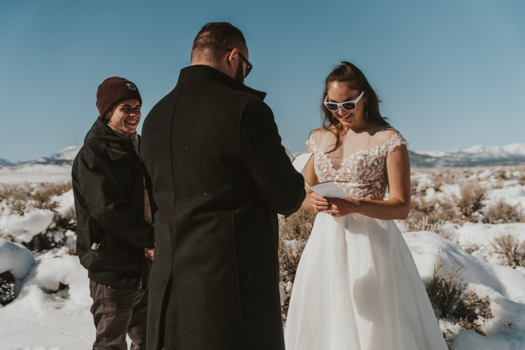 Bride and groom exchange vows in the snow in mammoth lakes california