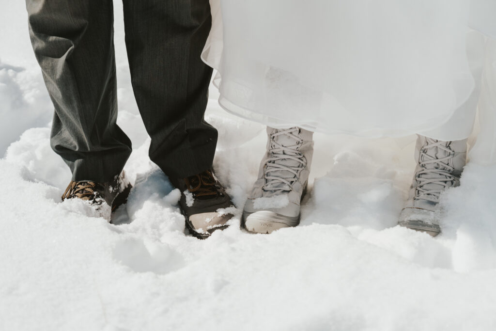 Snow boots on bride and groom in mammoth lakes