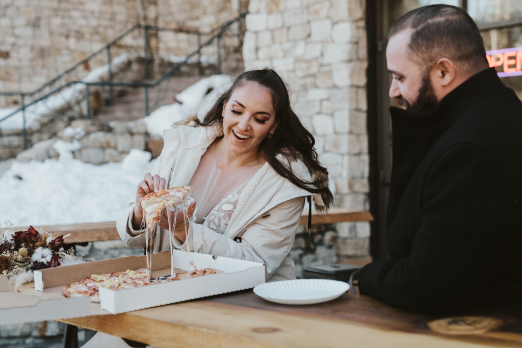 Bride and groom eat pizza after elopement in Mammoth Lakes California